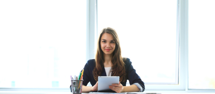 Girl Sitting At Desk With eMail Marketing